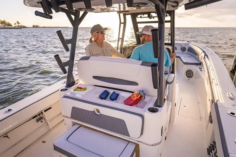 Slide: The Image of Manufacturer Provided Image: 2026 Cobia 305 Center Console boat with two people enjoying a sunny day on the water. - 6