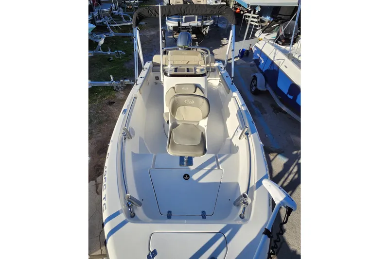 Slide: The Image of 2022 Key West 189 FS boat with seating and console, docked outdoors. - 15