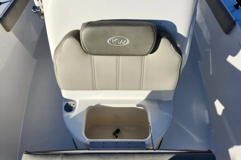Slide: The Image of 2022 Key West 189 FS boat seat with storage compartment, featuring KW logo. - 19