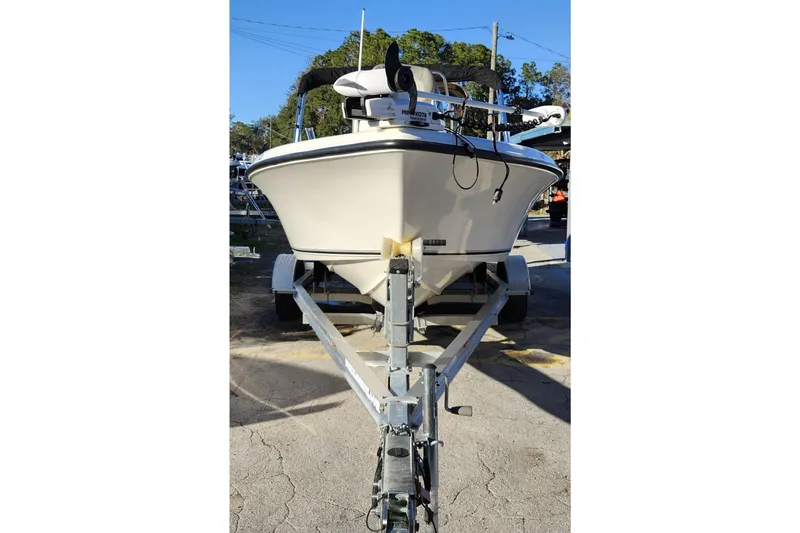 Slide: The Image of 2022 Key West 189 FS boat on trailer, parked outdoors, front view. - 2