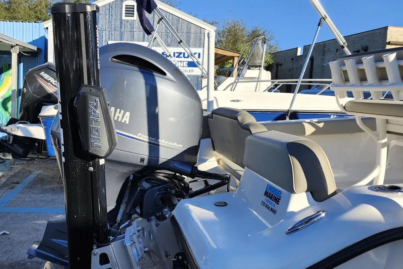 Slide: The Image of 2022 Key West 189 FS boat with Yamaha outboard motor at a marine dealership. - 7