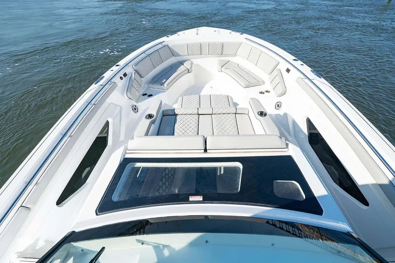 Slide: The Image of Manufacturer Provided Image: 2025 Pursuit S 428 Sport boat with spacious seating on open water. - 9