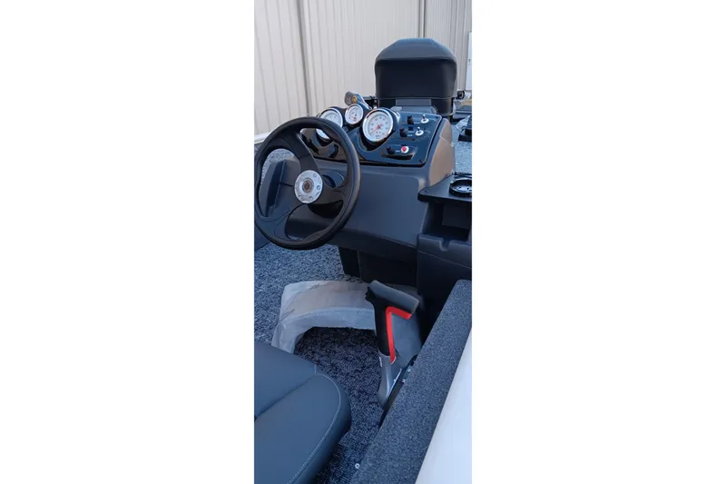 Slide: The Image of 2026 Tracker Pro 170 boat dashboard with steering wheel and gauges. - 14