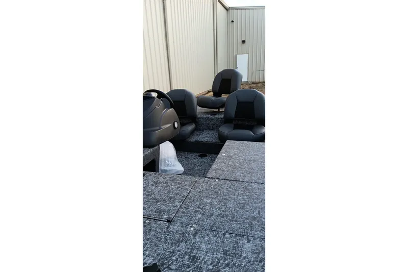 Slide: The Image of 2026 Tracker Pro 170 boat interior with seating and steering console. - 4