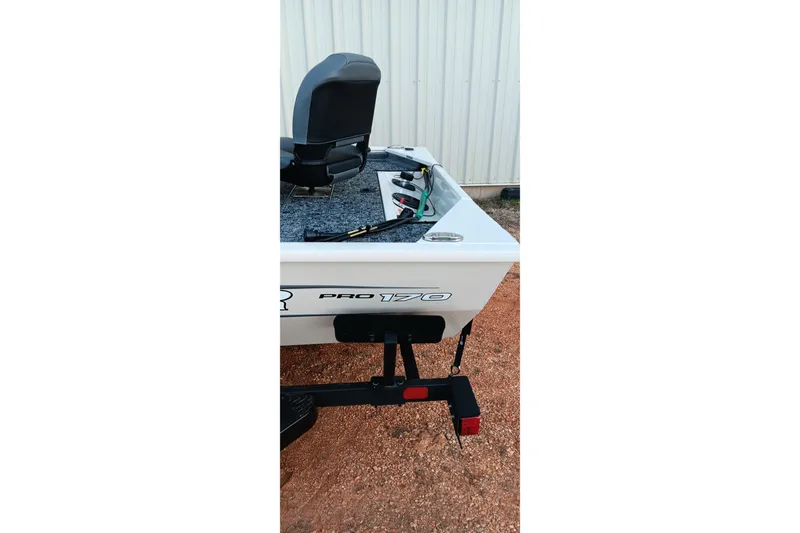 Slide: The Image of 2026 Tracker Pro 170 boat rear view with seat and trailer. - 7