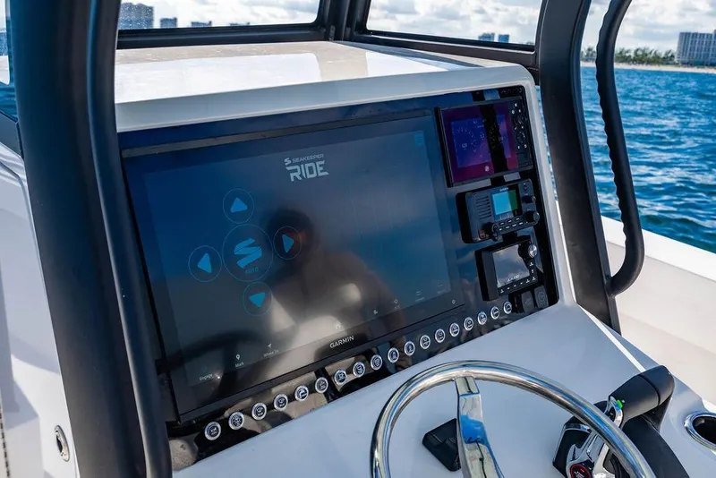 Slide: The Image of Control panel of 2026 Reef Runner 280 boat with advanced navigation system. - 20