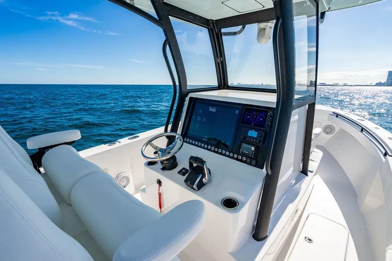 Slide: The Image of Modern 2026 Reef Runner 280 boat interior with advanced navigation system on open sea. - 24