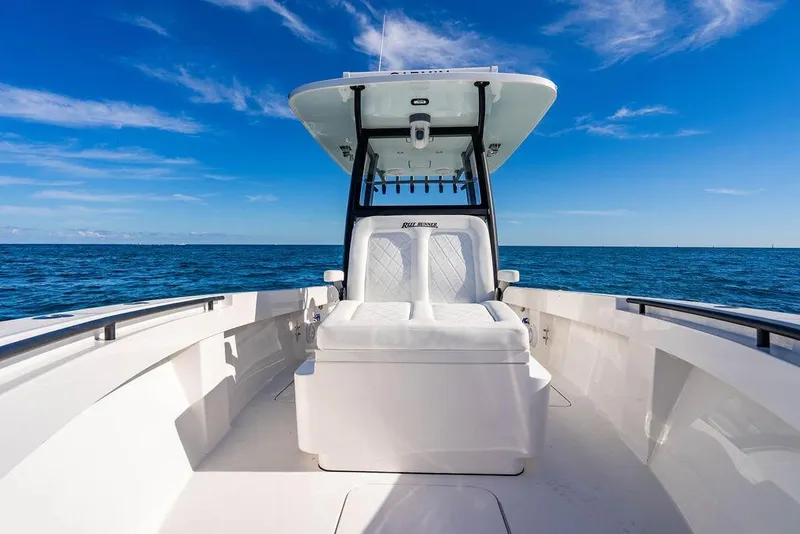 Slide: The Image of 2026 Reef Runner 280 boat on open sea under clear blue sky. - 30