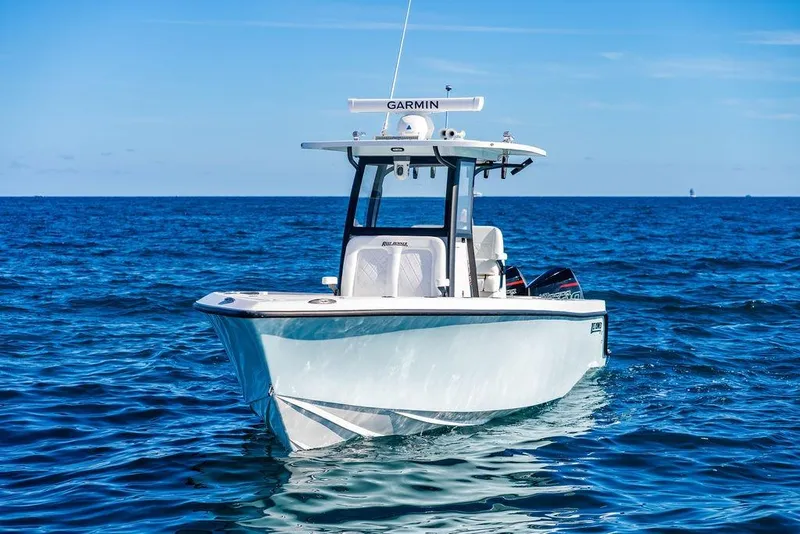 Slide: The Image of 2026 Reef Runner 280 boat cruising on open blue ocean waters. - 9