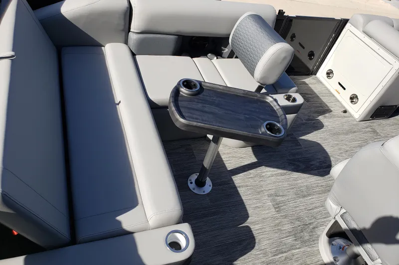 Slide: The Image of 2026 Bentley Pontoons Elite 253 interior with swingback bench and table, featuring modern design. - 11
