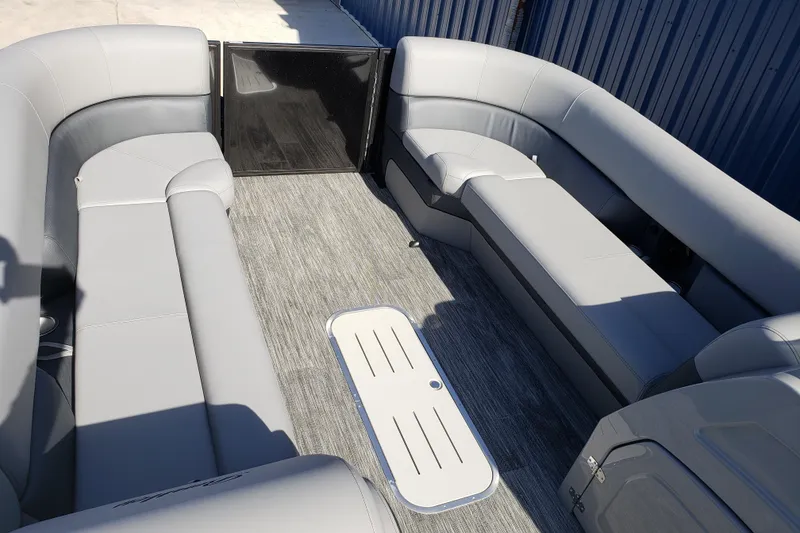 Slide: The Image of 2026 Bentley Pontoons Elite 253 Swingback Bench with luxurious gray seating and spacious layout. - 13