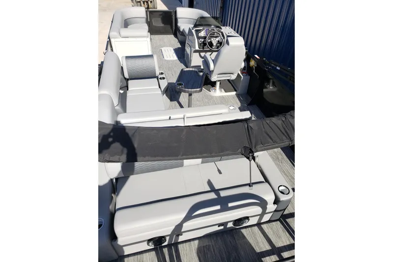Slide: The Image of 2026 Bentley Pontoons Elite 253 Swingback Bench interior with modern seating and helm. - 9