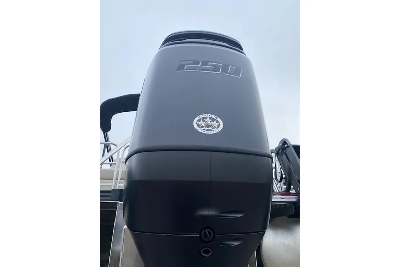 Slide: The Image of Close-up of 2026 Manitou 25 Encore SL SHP boat engine, showcasing 250 horsepower. - 13