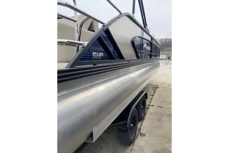 Slide: The Image of 2026 Manitou 25 Encore SL SHP pontoon boat on trailer, side view. - 5