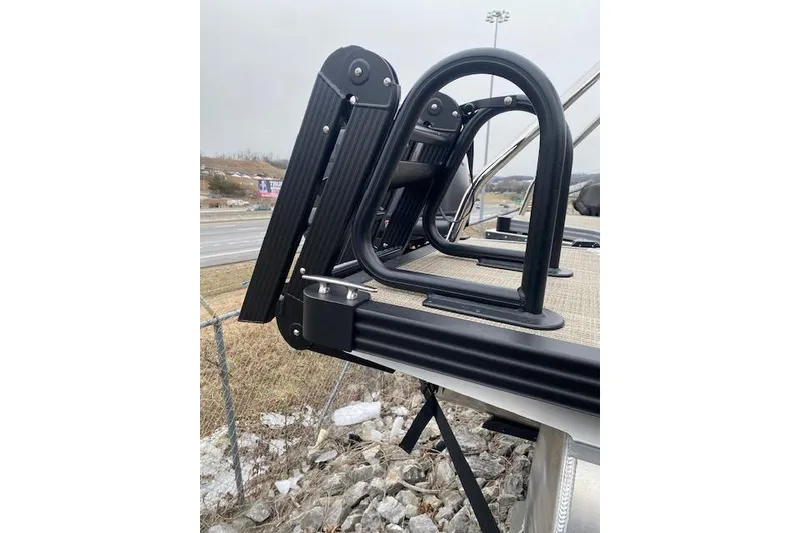 Slide: The Image of 2026 Manitou 25 Encore SL SHP boat ladder detail on a dock. - 6