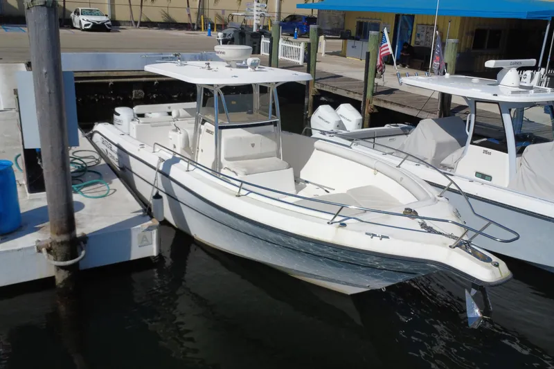The Image of 2006 Century 3200 Center Console boat docked at marina. - 0
