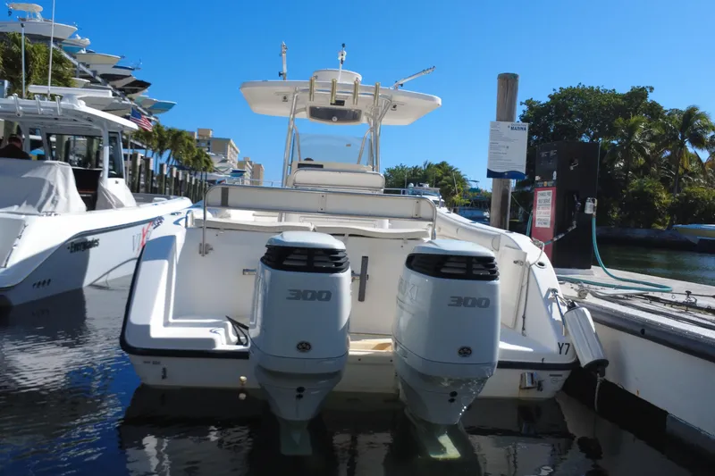 Slide: The Image of 2006 Century 3200 Center Console boat docked with twin 300 horsepower engines. - 11