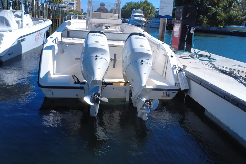Slide: The Image of 2006 Century 3200 Center Console boat docked with dual outboard engines. - 13