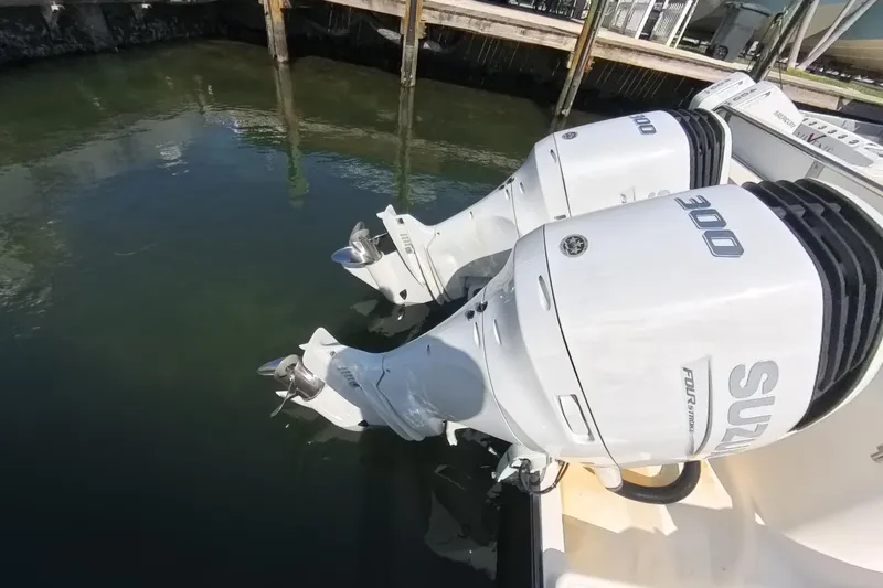 Slide: The Image of Twin Suzuki 300 outboard engines on a 2006 Century 3200 Center Console boat. - 16