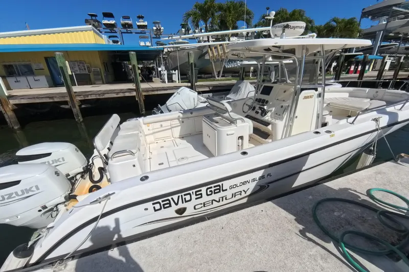 Slide: The Image of 2006 Century 3200 Center Console boat docked with Suzuki engines, labeled "David's Gal." - 19