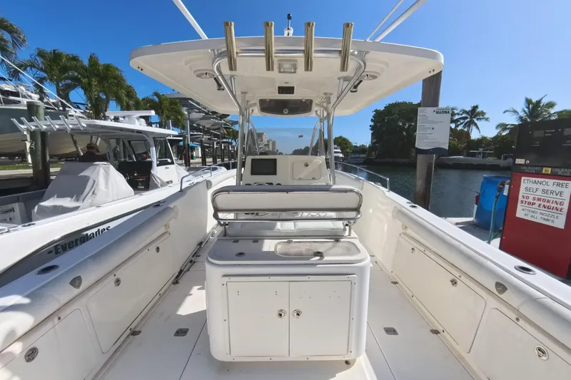 Slide: The Image of 2006 Century 3200 Center Console boat docked at marina, clear blue sky. - 23