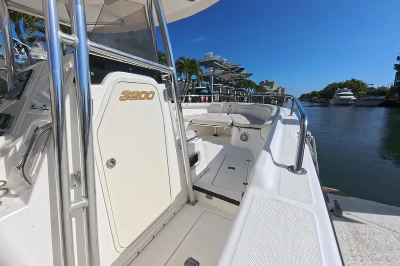 Slide: The Image of 2006 Century 3200 Center Console boat docked by a scenic waterfront. - 29