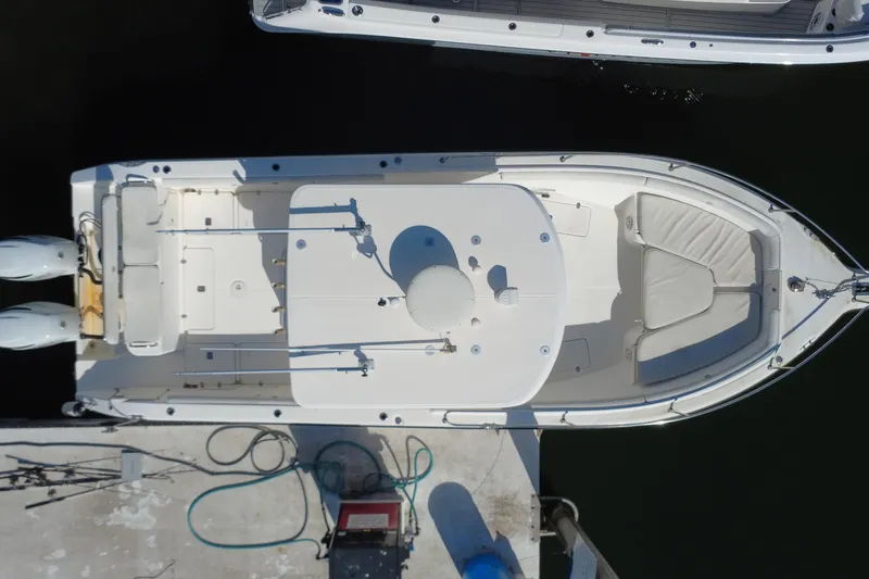 Slide: The Image of Top view of a 2006 Century 3200 Center Console boat docked at a marina. - 4