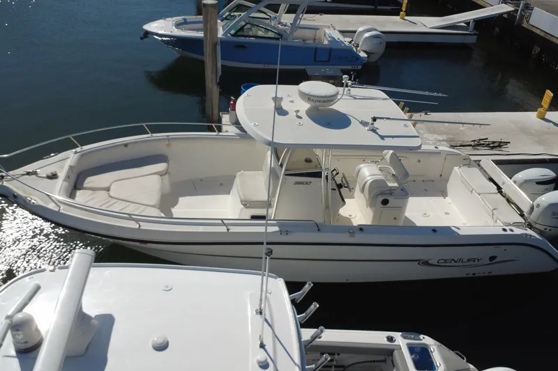 Slide: The Image of 2006 Century 3200 Center Console boat docked at marina, aerial view. - 7