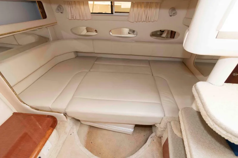 Slide: The Image of Luxurious interior cabin of 2002 Sea Ray Sundancer 310 with plush seating. - 12