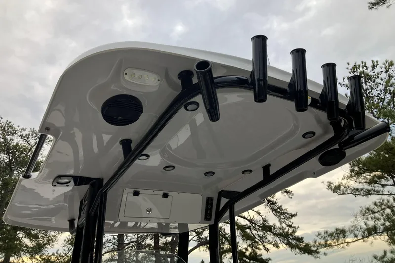 Slide: The Image of T-top of 2022 Sea Pro 239 Deep V CC boat with rod holders and speakers. - 13