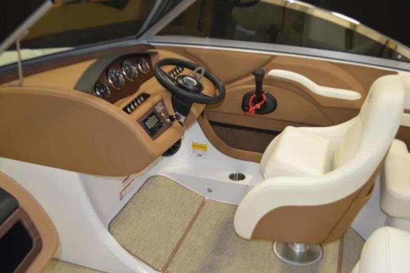 Slide: The Image of Interior of a 2015 Cobalt R3 boat, featuring a sleek dashboard and comfortable seating. - 3