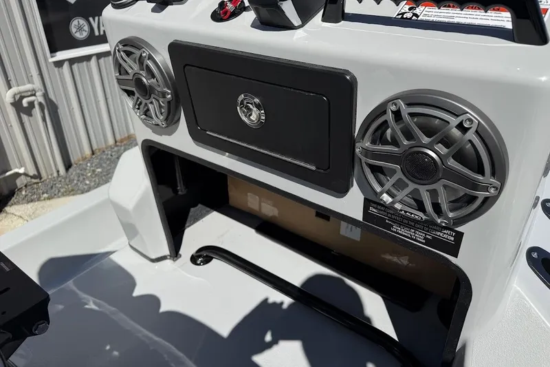 Slide: The Image of 2026 SCB R24 boat console with speakers and storage compartment. - 17