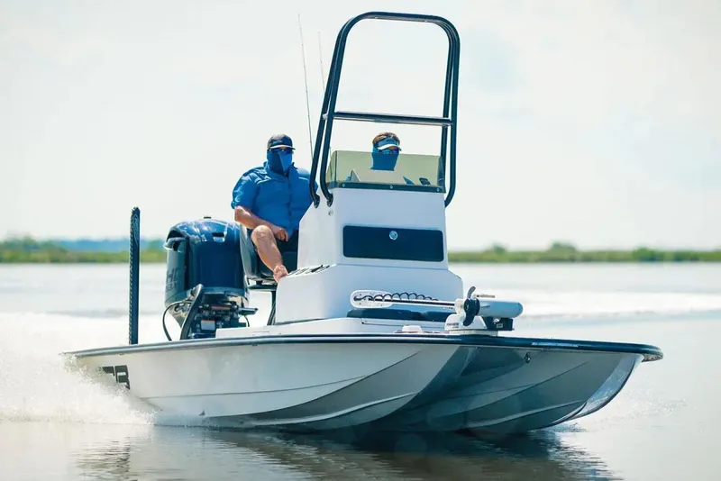 Slide: The Image of Manufacturer Provided Image: 2026 SCB R24 boat cruising on water with two passengers. - 3