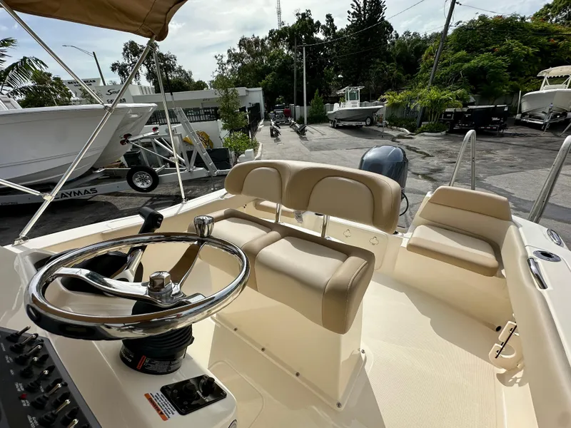 Slide: The Image of Interior view of 2025 Scout 195 Sportfish with helm and seating. - 3