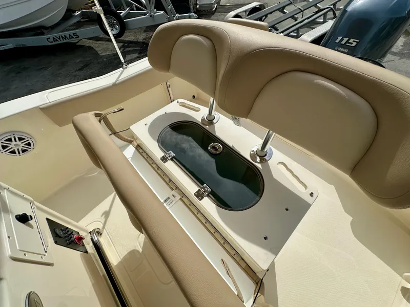 Slide: The Image of Interior view of 2025 Scout 195 Sportfish with seating and storage. - 5