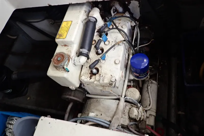 Slide: The Image of 1988 Mainship engine compartment with visible components and wiring. - 106