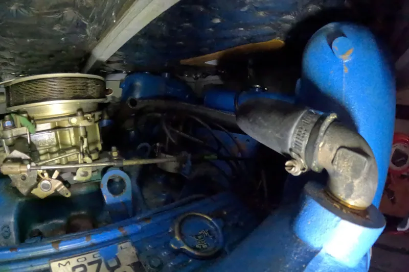 Slide: The Image of 1988 Mainship engine compartment with blue components and visible mechanical parts. - 113