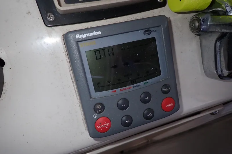 Slide: The Image of Raymarine ST6002 autopilot control on 1988 Mainship boat dashboard. - 29