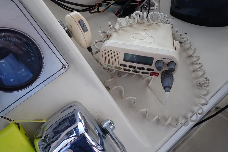 Slide: The Image of 1988 Mainship boat dashboard with radio and RPM gauge. - 30