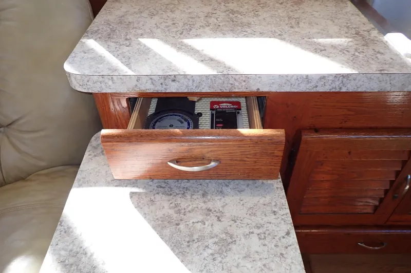 Slide: The Image of Open drawer in 1988 Mainship boat with Velcro and timer inside. - 58