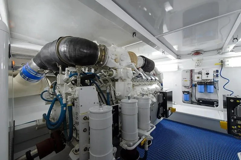 Slide: The Image of Engine room of a 1987 Merritt Boat Works Sport Fisherman, showcasing machinery and equipment. - 57