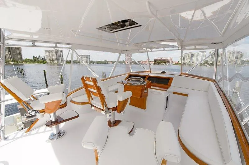 Slide: The Image of Interior of 1987 Custom Carolina Merritt yacht with elegant white seating. - 13