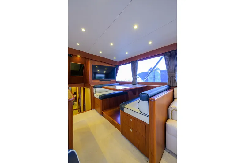 Slide: The Image of Interior of 1987 Merritt Boat Works Sport Fisherman with seating and window view. - 23