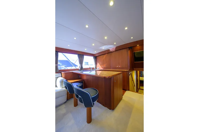 Slide: The Image of Luxurious interior of 1987 Merritt Sport Fisherman yacht with elegant wood finishes and seating. - 31