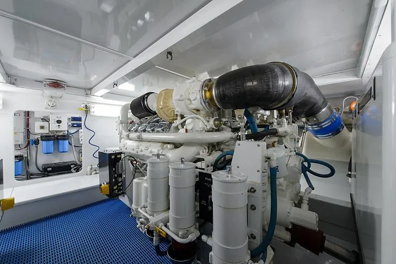 Slide: The Image of Engine room of 1987 Merritt Boat Works Sport Fisherman, featuring advanced machinery and equipment. - 56