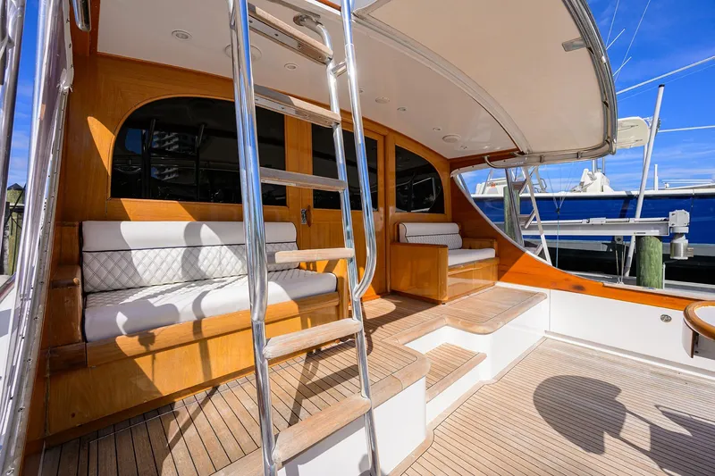 Slide: The Image of 1987 Merritt Boat Works Sport Fisherman with teak deck and cushioned seating. - 9