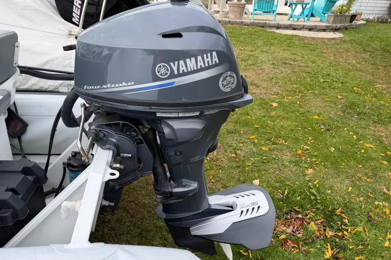 Slide: The Image of 2019 Highfield Classic 380 with Yamaha four-stroke outboard motor on grassy lawn. - 11