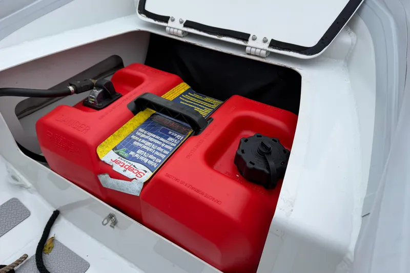 Slide: The Image of Red fuel tank in a 2019 Highfield Classic 380 boat storage compartment. - 15