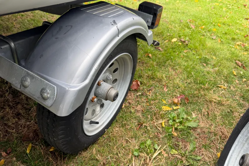 Slide: The Image of Trailer wheel of a 2019 Highfield Classic 380 on grass with fallen leaves. - 18