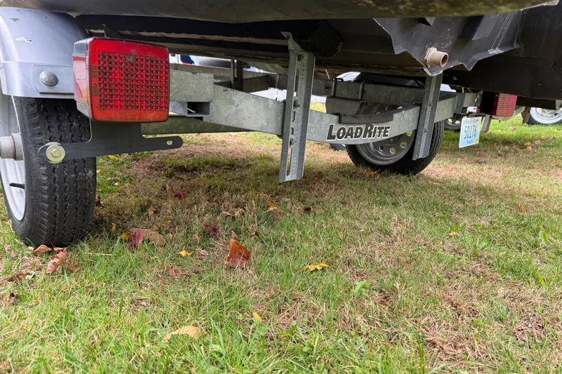 Slide: The Image of Trailer for 2019 Highfield Classic 380 boat on grass, featuring Load Rite branding. - 19